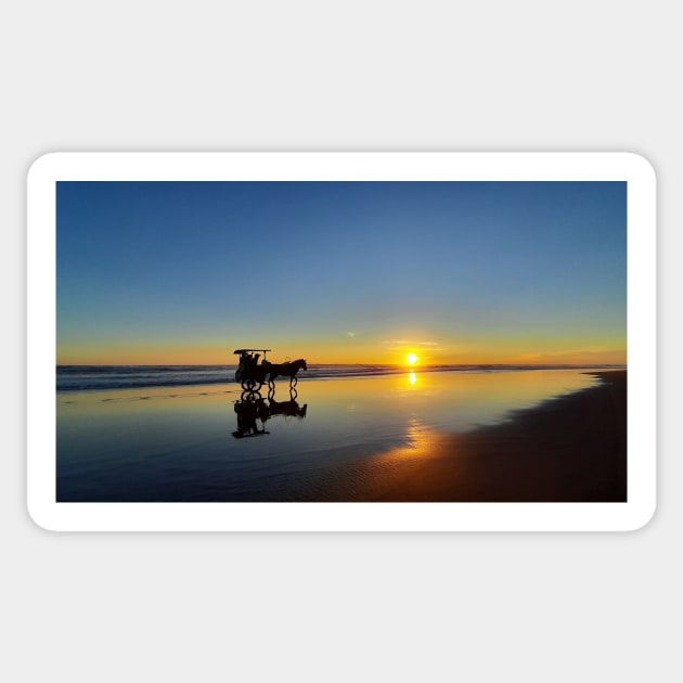 A silhouetted horse-drawn carriage on Parangtritis beach at sunset 2 Sticker by kall3bu